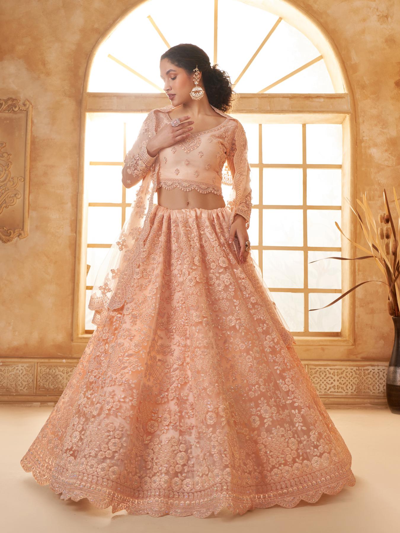 Scanty Peach Heavy Embroidered Net Lehenga Choli With Dupatta