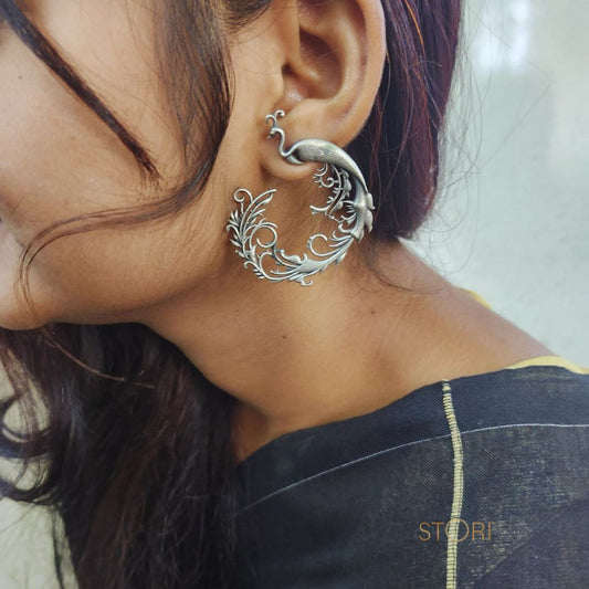 Mayura Curved Peacock Silver Look Alike Earrings