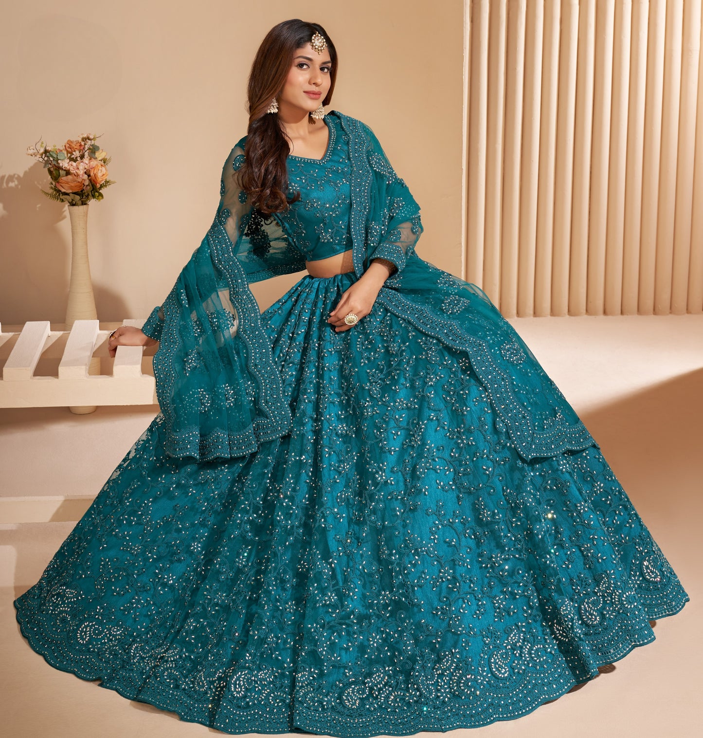 Peacock Blue Heavy Embroidered Net Lehenga