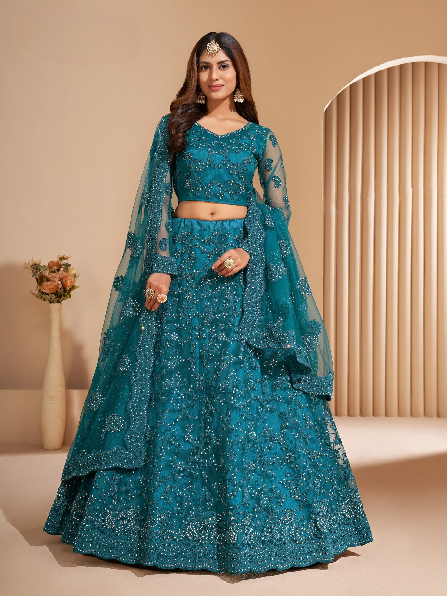 Peacock Blue Heavy Embroidered Net Lehenga