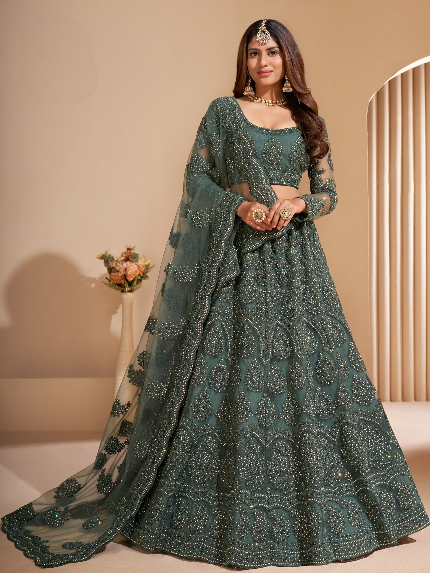 Seaweed Green Heavy Embroidered Net Lehenga