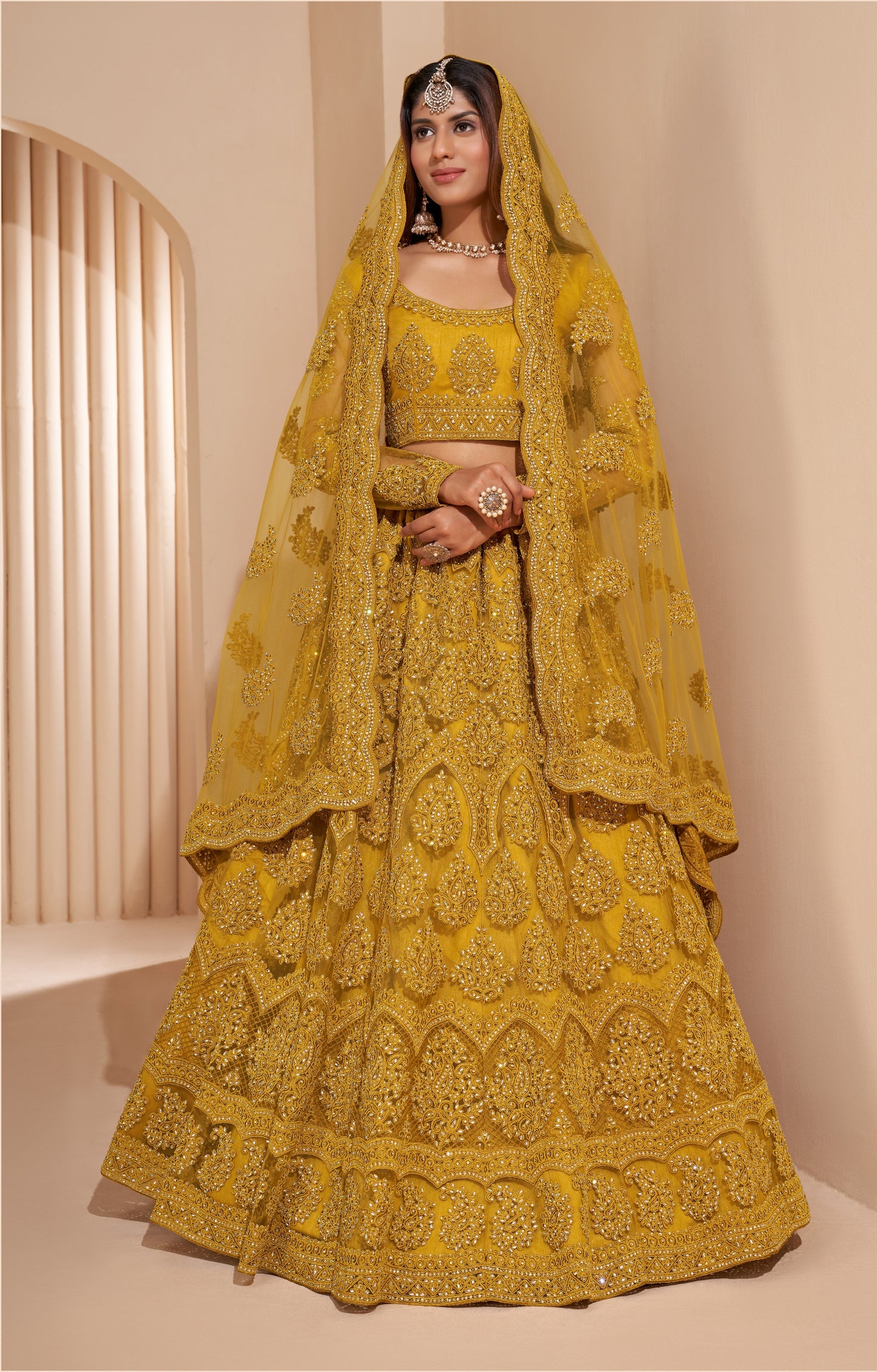 Turmeric Yellow Heavy Embroidered Net Lehenga