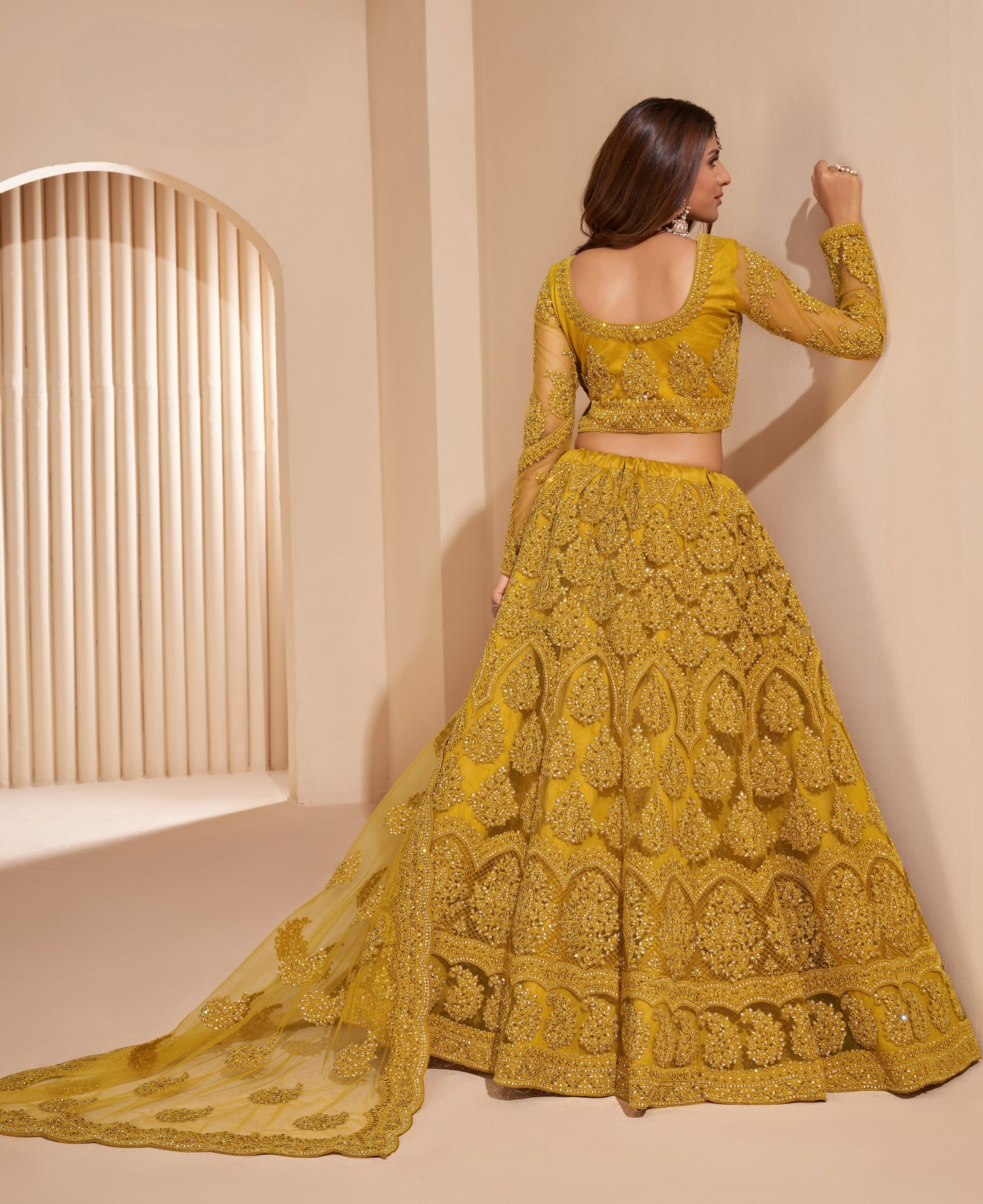 Turmeric Yellow Heavy Embroidered Net Lehenga