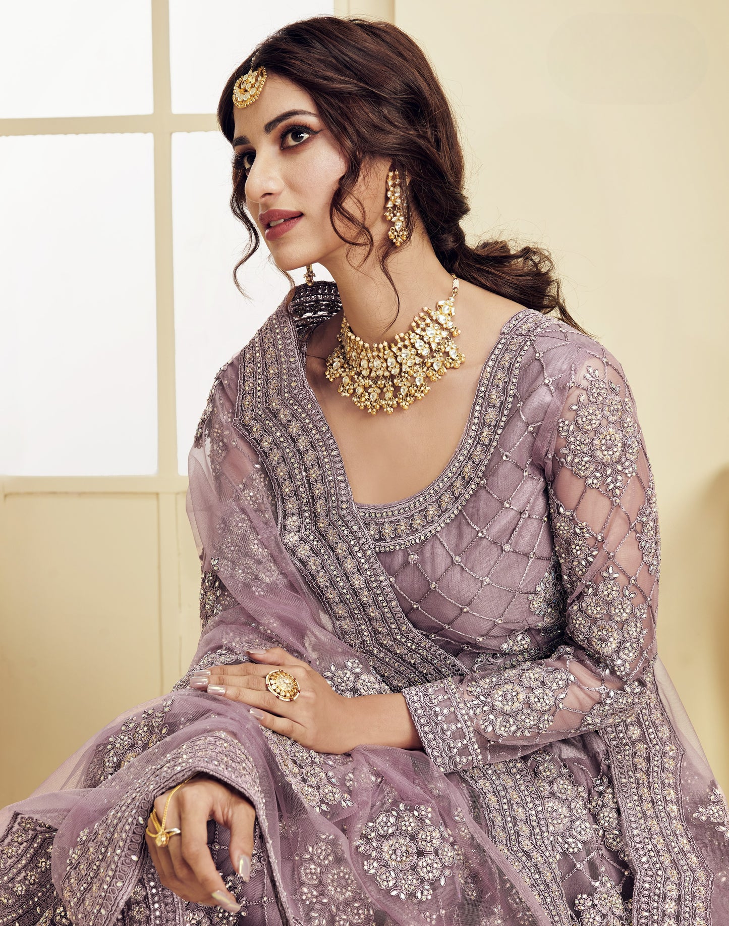 Beautiful Mauve Heavy Embroidered Net Lehenga