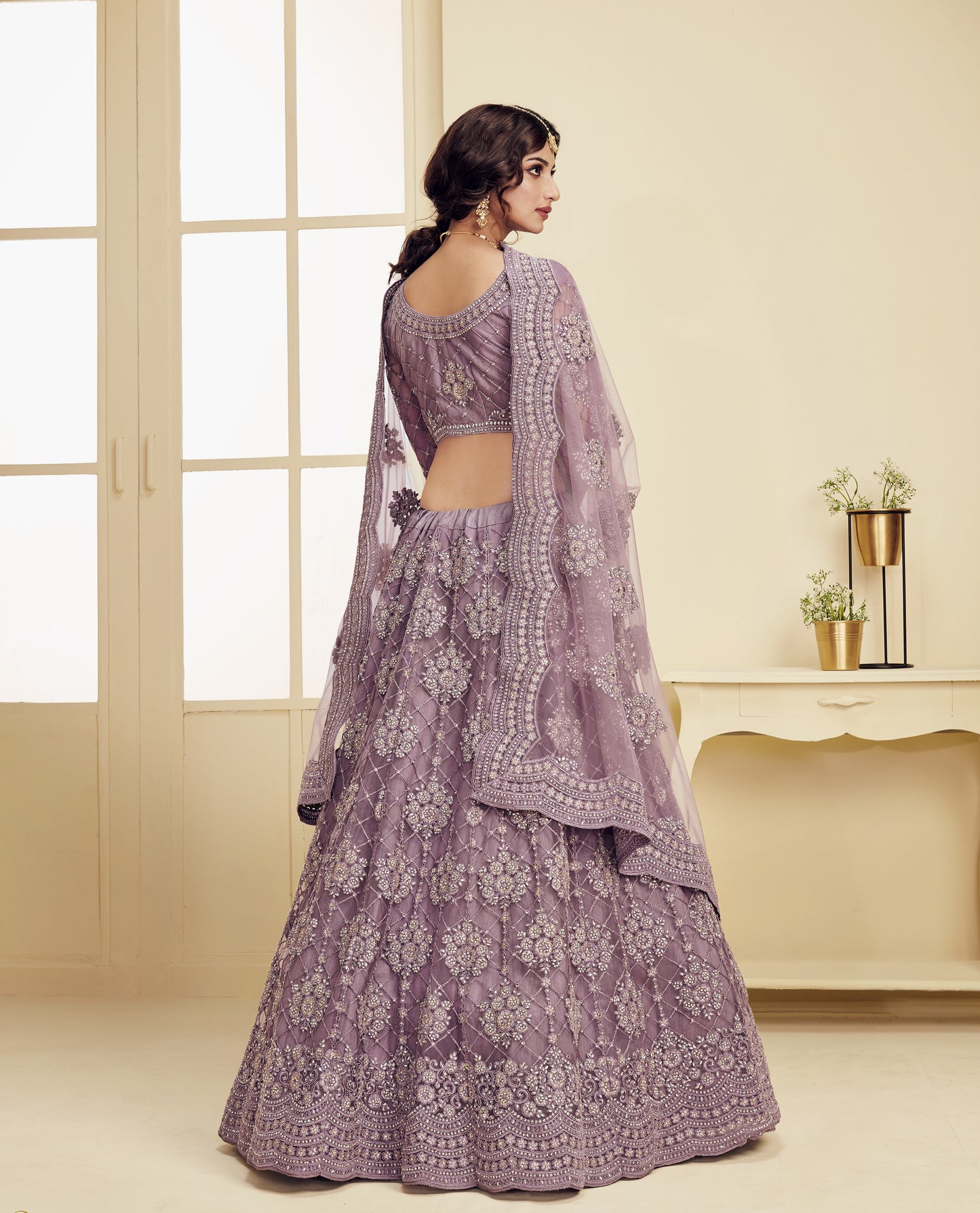 Beautiful Mauve Heavy Embroidered Net Lehenga