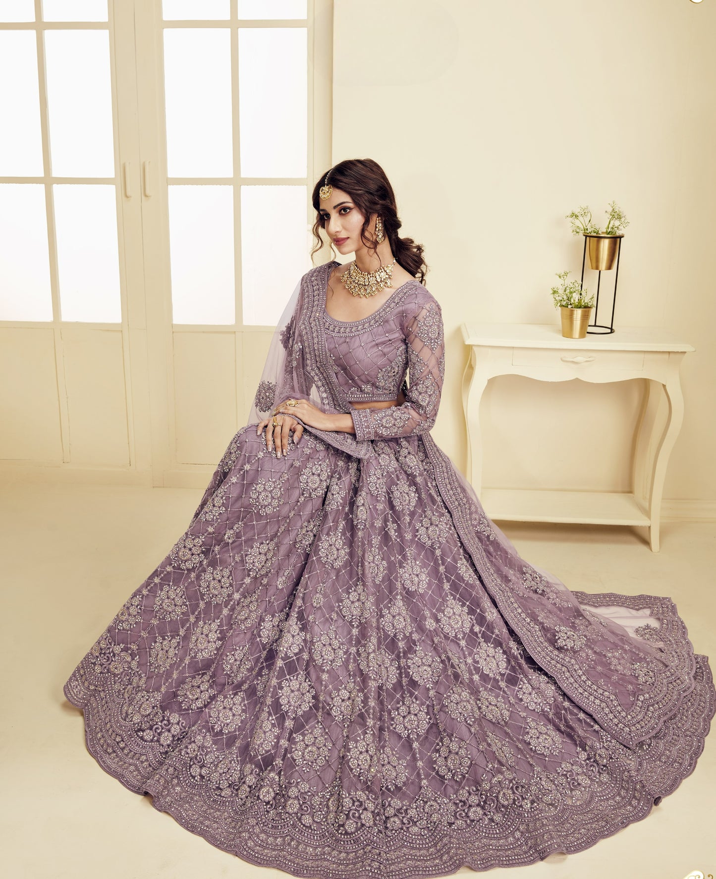 Beautiful Mauve Heavy Embroidered Net Lehenga