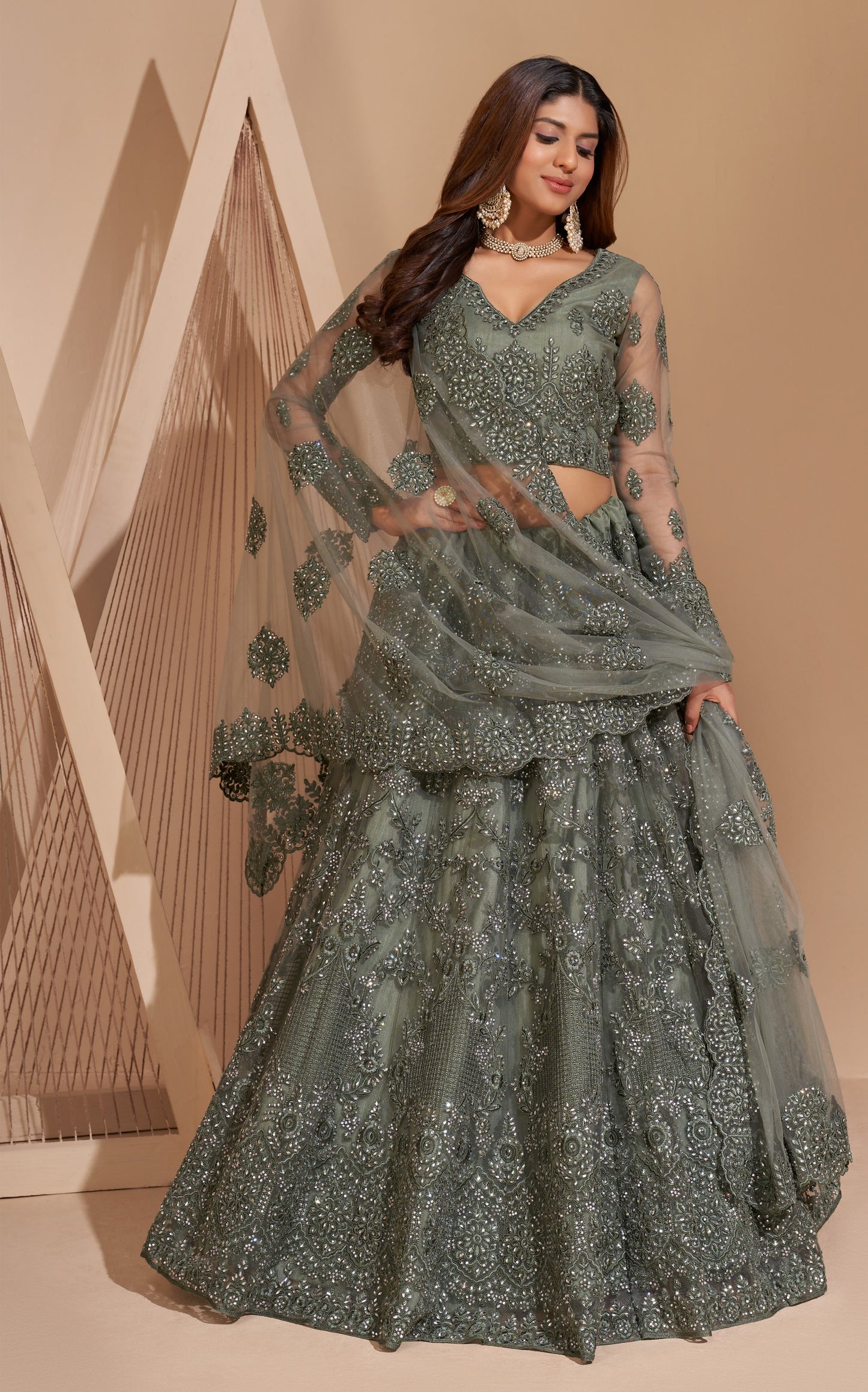 Smoky Green Heavy Embroidered Net Lehenga