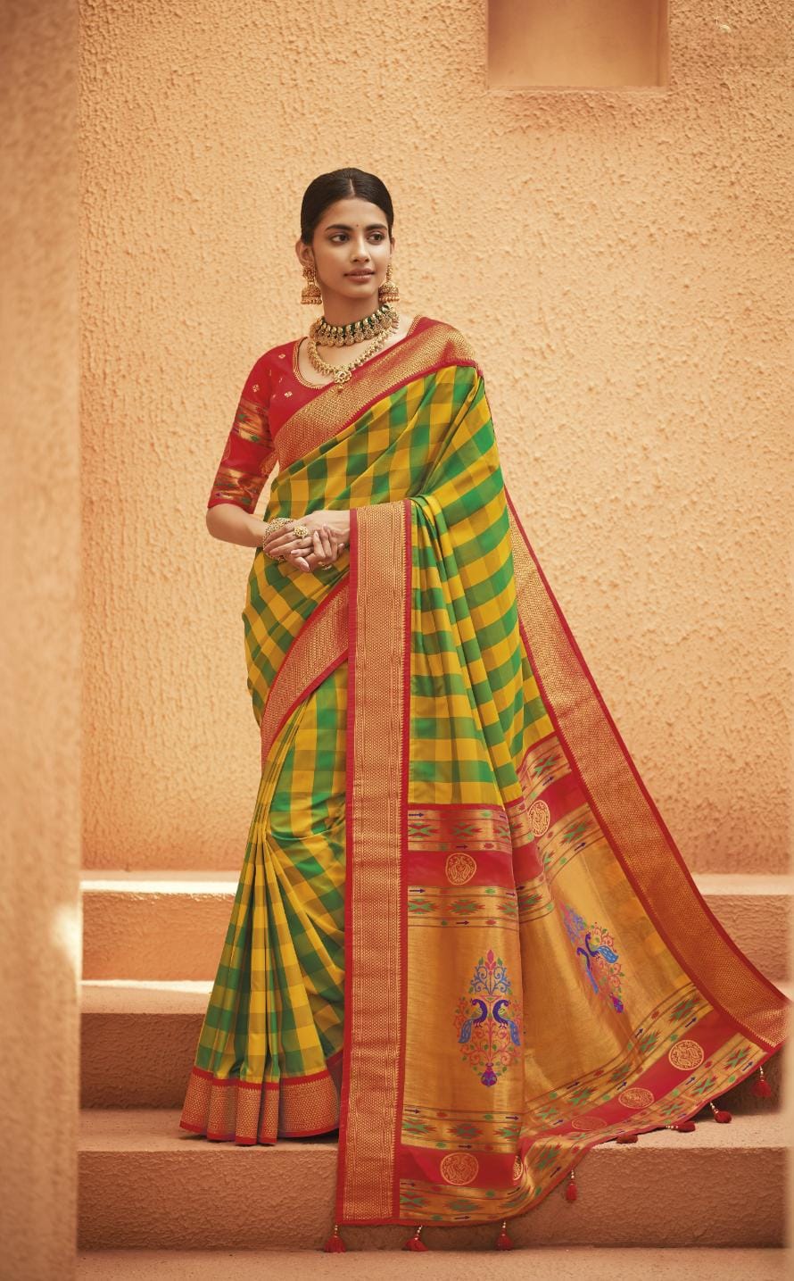 Mustard yellow silk saree with green cutwork embroidery and mirrorwork